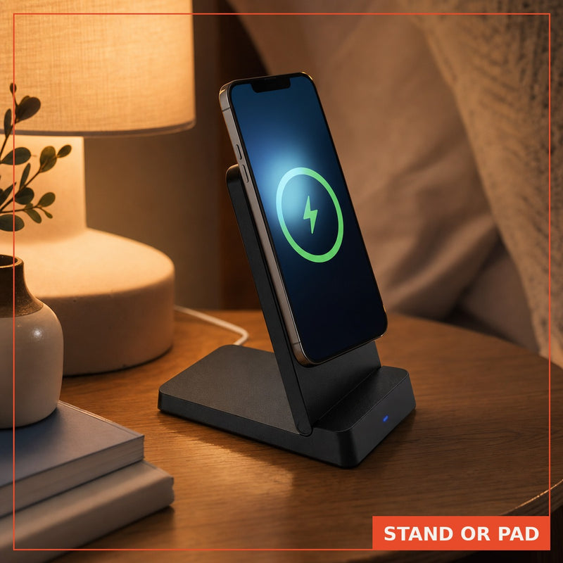 iPhone charging on the MagSnap stand on a wooden nightstand at dusk